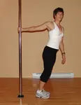 The Pole Shoulder Stretch uses your dance pole to help you lengthen and work the kinks out of the front of your shoulders and pectoral muscles. Learn how to get the benefits here.